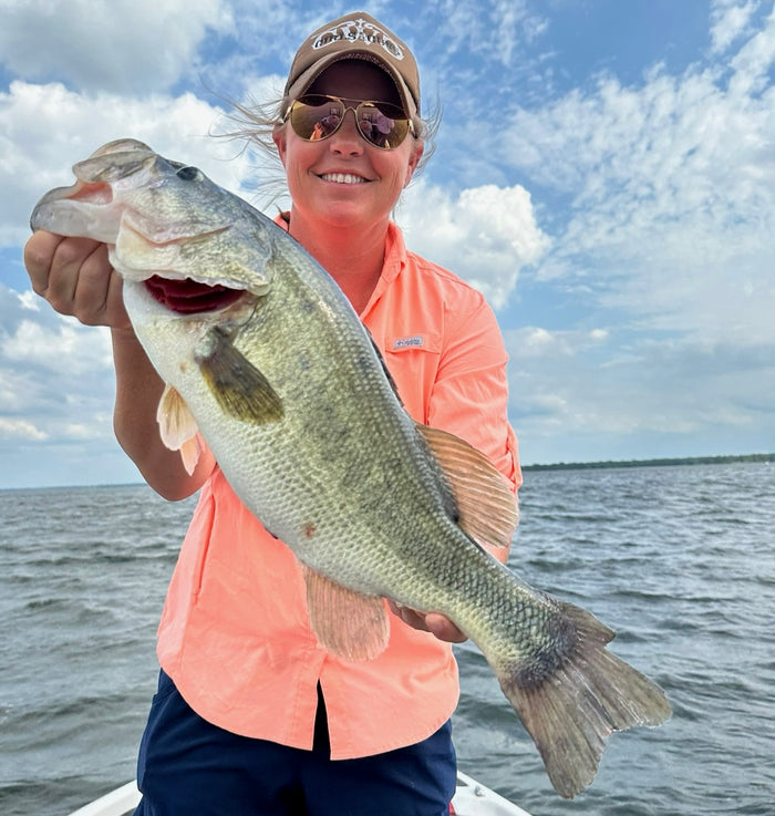 women fishing lake fork in the summer catching large mouth bass